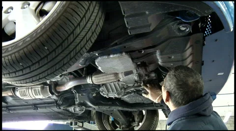 Auto mechanic repairing car Stock Footage