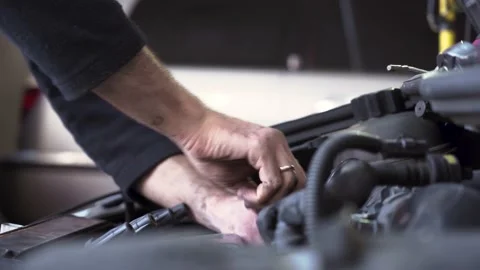 Auto mechanic repairing the engine of an old car. Stock-Footage 212603562