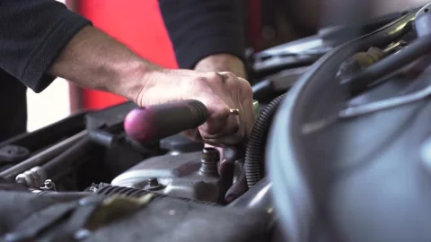 Auto mechanic repairing the engine of an old car. close-up Stock Footage 212603624