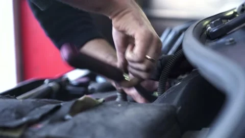 Auto mechanic repairing the engine of an old car. Stock Footage 215785568