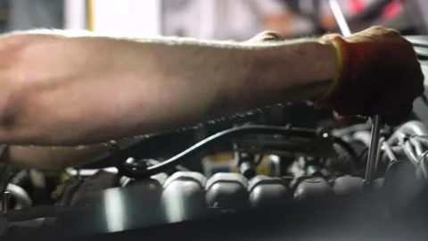 Auto mechanic repairs automobile engine. auto repair station. close-up. Stock Footage 206079078