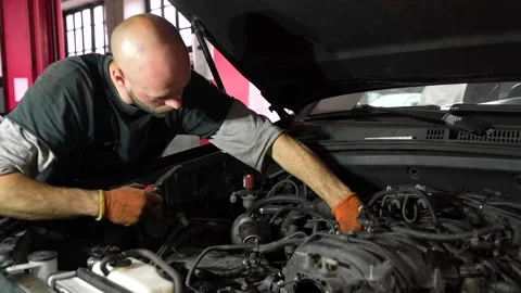 Auto mechanic repairs car engine. car service. auto repair shop Stock Footage 204877241