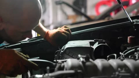 Auto mechanic repairs car engine. car service. close-up. Stock Footage 204877387