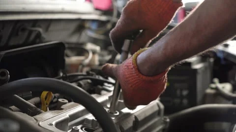 Auto mechanic repairs car engine. auto repair shop. close-up Stock Footage 205509485