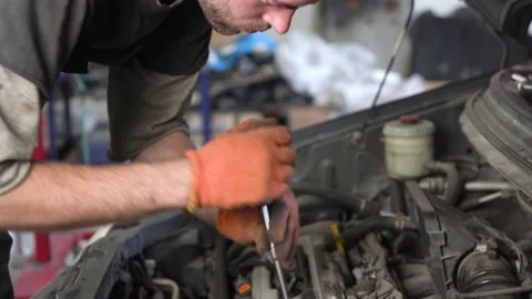 Auto mechanic repairs car engine. auto repair shop. close-up Stock Footage 205509498