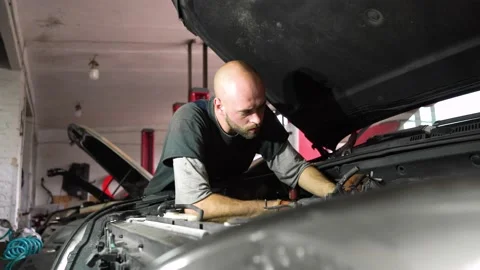 Auto mechanic repairs car engine. car service. close-up. Stock Footage 206078416
