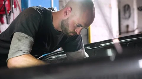 Auto mechanic repairs car engine. car service. close-up Видео 206079051
