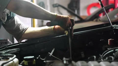 Auto mechanic repairs car engine. car service. close-up 動画素材 206079388