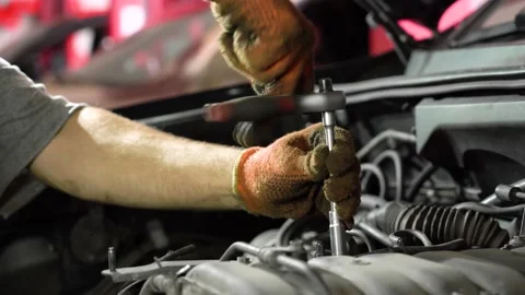 Auto mechanic repairs car engine. auto repair station. close-up. Stock Footage 206079498
