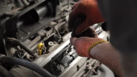 Auto mechanic repairs car engine. auto repair shop. close-up Stock Footage 207786751