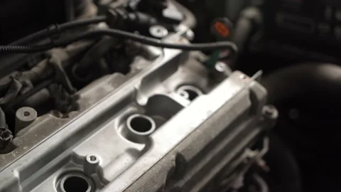 Auto mechanic repairs car engine. auto repair shop. spark plug replacement Stock Footage 207786979