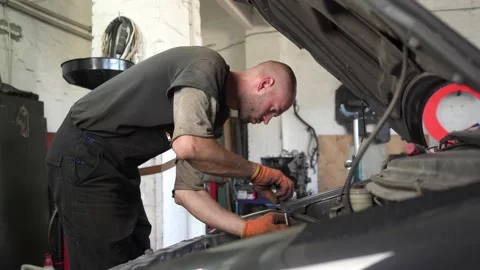 Auto mechanic repairs car engine. auto repair shop. diagnostics Видео 207786992