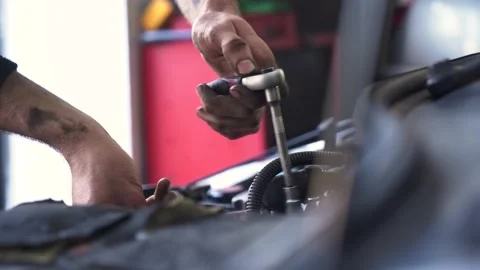 Auto mechanic repairs a car engine. fuel injector replacement. Stock Footage 211810891