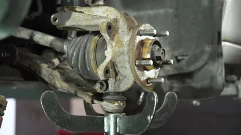 Auto mechanic repairs an old used car. auto repair shop. Video stock 215787774