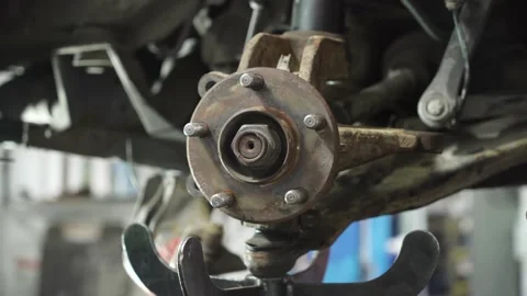 Auto mechanic repairs an old used car. auto repair shop. removal of old parts. Stock Footage 215788637