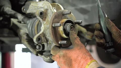 Auto mechanic repairs an old used car. auto repair shop. removal of old parts. Stock Footage 215788836