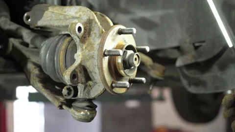 Auto mechanic repairs an old used car. auto repair shop. Stock Footage 215789201