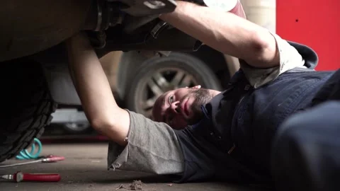 Auto mechanic repairs SUV. close-up Stock Footage 204878450