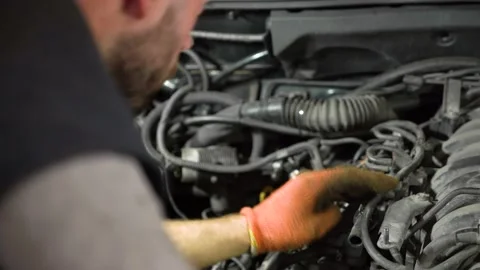 Auto mechanic repairs SUV engine. auto repair station. close-up Stock Footage 205232729