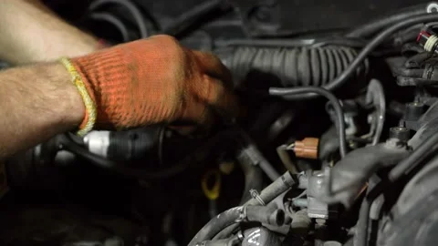 Auto mechanic repairs SUV engine. auto repair station. close-up Stock Footage 206078687