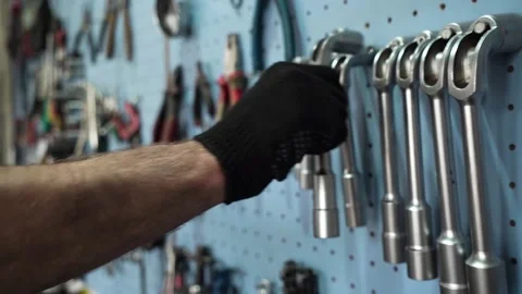 Auto mechanic takes a working tool for car repair Stock Footage 205003389