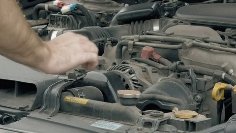 Auto mechanic visually examines car motor engine Video stock 69998939