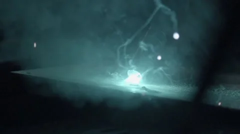 Auto mechanic a welding machine in slow motion Stock Footage 58882357