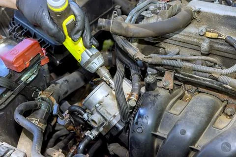 As an auto mechanic working in auto garage, responsible for maintenance repair Stock Photos