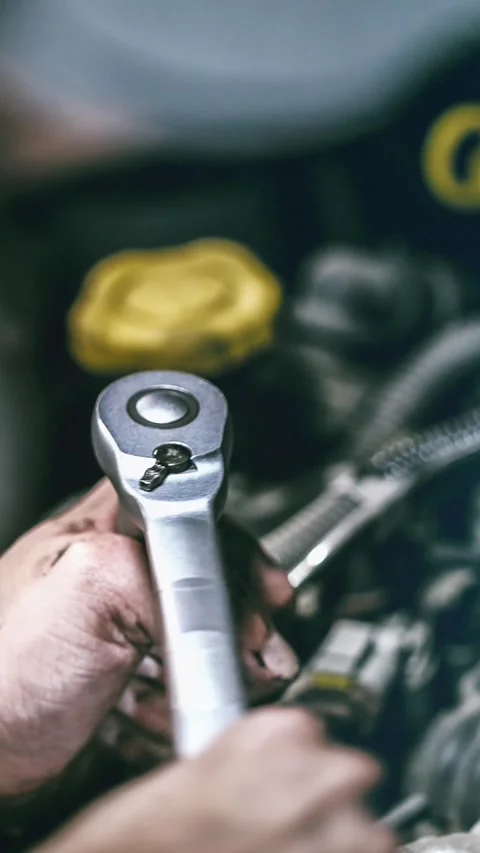 Auto mechanic working on car engine in mechanics garage. Repair service. au.. Stock Footage 254491808