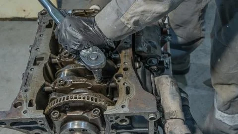 Auto mechanic working on car engine in mechanics garage.Repair service.Prof.. Stock Photos