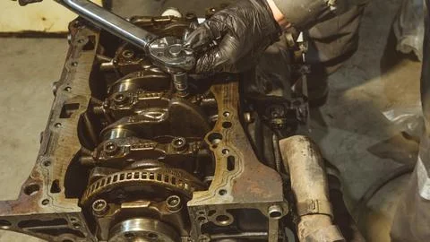 Auto mechanic working on car engine in mechanics garage.Repair service.Prof.. Stock Photos