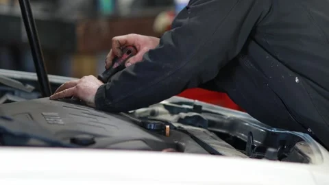 Auto Mechanic Working on a Car Stock Footage 244362082