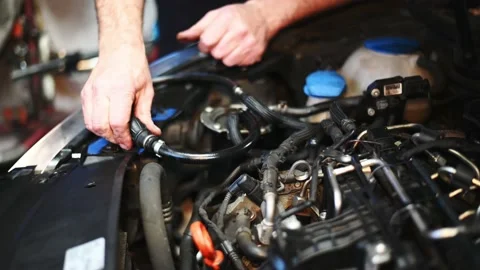 Auto mechanic working on car at the garage. Auto repair shop, Car service Video stock 141340231