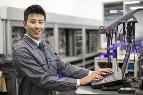Auto mechanic working with computer Stock Photos