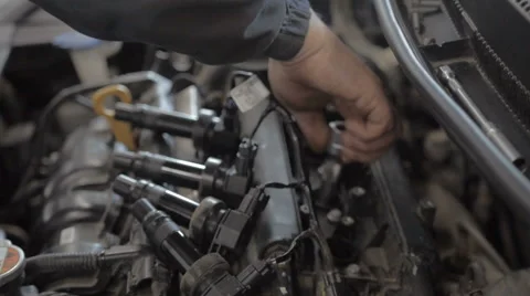 Auto Mechanic is Working on Engine in Car Repair Shop Stock Footage