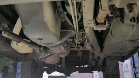 Auto mechanic working on engine oil change Stock Footage 124694554