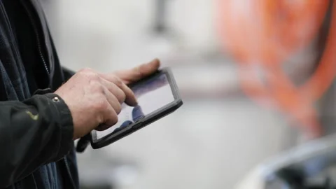 Auto Mechanic Working on iPad Stock Footage 244361012