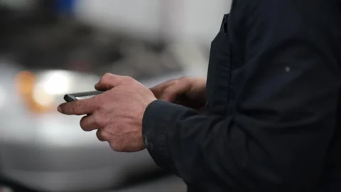 Auto Mechanic Working on iPad Stock Footage 244362487