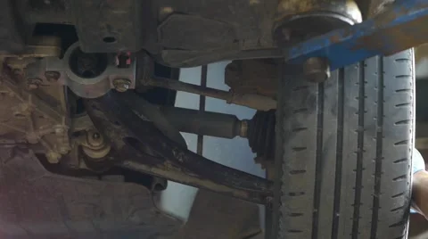 Auto mechanic working on a wheel from the machine damage 44 Stock Footage 58286845