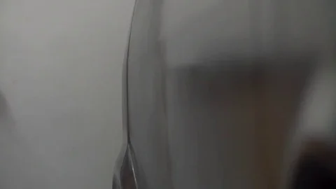 Auto painter spraying paint on car in special booth Stock Footage 85369498