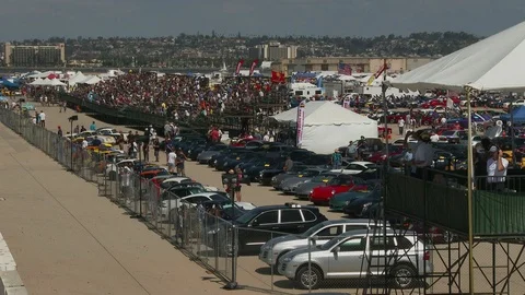 Auto race spectators &amp; flag man as race gets underway. Stock Footage 89437197