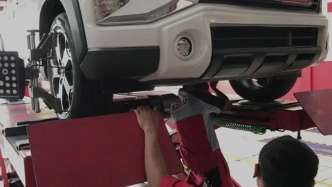 Auto repair fixed with computerized wheel alignment machine Stock Footage 212084946