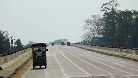 Auto Rickshaw and Vehicles Moving on Bridge Road in Dibrugarh Stock Footage 328821234