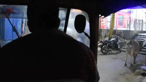 Auto rickshaw driver at night Stock Footage 170623247