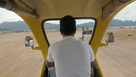 Auto rickshaw driver in the Philippines rear view Stock-Footage 131782916