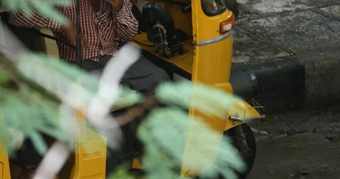 Auto-rickshaw-driver-smoking Stock Footage 141172427