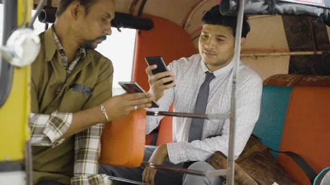 Auto rickshaw or cab passenger paying money by scanning qr code on mobile phone 스톡 동영상 168694149