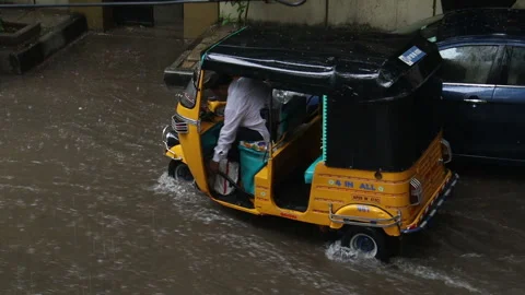 Auto-rickshaw-stuck-in-rainwater-2 Stock Footage 137368594