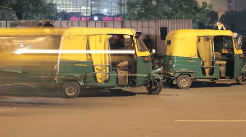 Auto rickshaws and taxis in Delhi, India - motion time-lapse Stock Footage