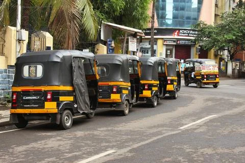 Auto rickshaws standing in queue on road, Pune, Maharashtra, India Stock Photos